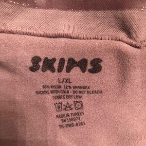 Skims sculpting mid waist brief in Umber color